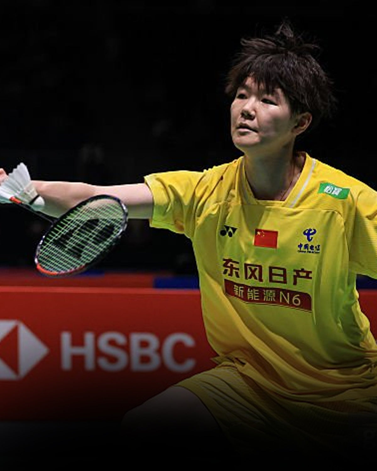 Han Qianxi reaching for a shot with her Yonex racket