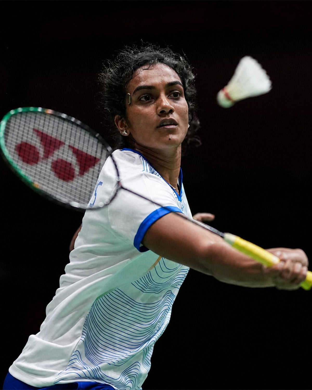 PV Sindhu playing a shot with her Yonex racket